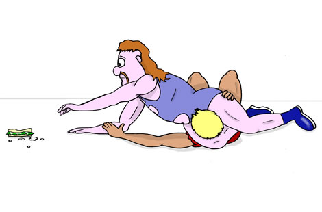 A man applies a head-scissors to his opponent