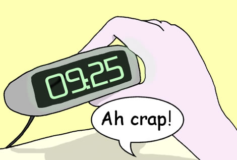 A man looks at his bedside clock