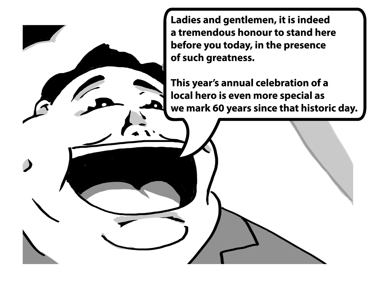 A rotund man on the stage begins to speak loudly to the onlooking crowd